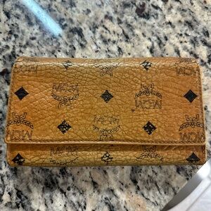 Authentic MCM Large Tri Fold Wallet in Visetos Original Cognac preowned.